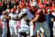LINCOLN, NE - OCTOBER 5: Running back Josh Ferguson #6 of the Illinois Fighting Illini is wrapped up by linebacker Jared Afalava #33 of the Nebraska Cornhuskers during their game at Memorial Stadium on October 5, 2013 in Lincoln, Nebraska. (Photo by Eric