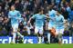 MANCHESTER, ENGLAND - NOVEMBER 24: Jesus Navas of Manchester City celebrates scoring the opening goal with team mate Samir Nasri (R) during the Barclays Premier League match between Manchester City and Tottenham Hotspur at Etihad Stadium on November 24,