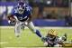 Nov 17, 2013; East Rutherford, NJ, USA; New York Giants running back Brandon Jacobs (34) is tackled by Green Bay Packers corner back Tramon Williams (38) during the first quarter of a game at MetLife Stadium. Mandatory Credit: Brad Penner-USA TODAY Sports