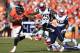 DENVER, CO - JANUARY 19: Knowshon Moreno #27 of the Denver Broncos runs the ball against the New England Patriots during the AFC Championship game at Sports Authority Field at Mile High on January 19, 2014 in Denver, Colorado. (Photo by Jamie Squire/Ge