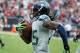HOUSTON, TX - SEPTEMBER 29: Richard Sherman #25 of the Seattle Seahawks returns an interception 58 yaerds for a touchdown in the second half against the Houston Texans at Reliant Stadium on September 29, 2013 in Houston, Texas. (Photo by Scott Halleran
