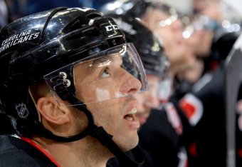 RALEIGH, NC - JANUARY 19: Manny Malhotra #22 of the Carolina Hurricanes watches action on the ice in his 900th game during an NHL game against  the Tampa Bay Lightning at PNC Arena on January 19, 2014 in Raleigh, North Carolina.  (Photo by Gregg Forwerck/