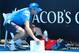 MELBOURNE, AUSTRALIA - JANUARY 14: A ballboy faints in the heat, as Melbourne heads towards 43 degrees celsius during day two of the 2014 Australian Open at Melbourne Park on January 14, 2014 in Melbourne, Australia. (Photo by Chris Hyde/Getty Images)