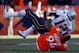 DENVER, CO - JANUARY 19: Tom Brady #12 of the New England Patriots is sacked by Terrance Knighton #94 of the Denver Broncos on a fourth down in the fourth quarter during the AFC Championship game at Sports Authority Field at Mile High on January 19, 2014