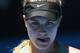 MELBOURNE, AUSTRALIA - JANUARY 23: Eugenie Bouchard of Canada looks on in her semifinal match against Na Li of China during day 11 of the 2014 Australian Open at Melbourne Park on January 23, 2014 in Melbourne, Australia. (Photo by Scott Barbour/Getty I