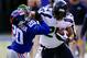 Dec 15, 2013; East Rutherford, NJ, USA; Seattle Seahawks running back Marshawn Lynch (24) stiff arms New York Giants cornerback Prince Amukamara (20) during the game at MetLife Stadium. Mandatory Credit: William Perlman/THE STAR-LEDGER via USA TODAY Sport