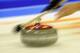 FUSSEN, GERMANY - DECEMBER 10: A player throws a rock during the Olympic Qualification Tournament on December 10, 2013 in Fussen, Germany. (Photo by Daniel Kopatsch/Getty Images,)