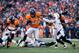 Jan 12, 2014; Denver, CO, USA; Denver Broncos running back Knowshon Moreno (27) runs the ball in the second quarter against the San Diego Chargers during the 2013 AFC divisional playoff football game at Sports Authority Field at Mile High. Mandatory Credi