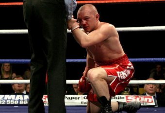 CARDIFF, WALES - MARCH 22:   Gavin Rees drops to the ground during the WBA light Welterweight fight against Andreas Kotelnik on March 22,  2008 at the Cardiff International Arena in Cardiff, Wales. (Photo by John Gichigi/Getty Images)