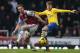 LONDON, ENGLAND - DECEMBER 26: Aaron Ramsey of Arsenal holds off Kevin Nolan of West Ham United during the Barclays Premier League match between West Ham United and Arsenal at Boleyn Ground on December 26, 2013 in London, England. (Photo by Ian Walton/G