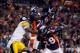 DENVER, CO - JANUARY 08: Champ Bailey #24 of the Denver Broncos nearly intercepts a pass intended for Mike Wallace (L) #17 of the Pittsburgh Steelers, as Quinton Carter #28 of the Denver Broncos looks on during the AFC Wild Card Playoff game at Sports Au