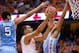 SYRACUSE, NY - JANUARY 11: Tyler Ennis #11 of the Syracuse Orange puts in a lay up between defenders Marcus Paige #5 and J.P. Tokoto #13 of the North Carolina Tar Heels in the first half on January 11, 2014 at The Carrier Dome in Syracuse, New York. (Pho