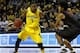 NEW YORK, NY - DECEMBER 21: Glenn Robinson III #1 of the Michigan Wolverines drives against Josh Huestis #24 of the Stanford Cardinals during the Brooklyn Hoops Holiday Invitational at Barclays Center on December 21, 2013 in the Brooklyn borough of New Y