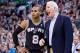 Nov 15, 2013; Salt Lake City, UT, USA; San Antonio Spurs head coach Gregg Popovich talks with point guard Patty Mills (8) during the second half against the Utah Jazz at EnergySolutions Arena. San Antonio won 91-82. Mandatory Credit: Russ Isabella-USA TOD