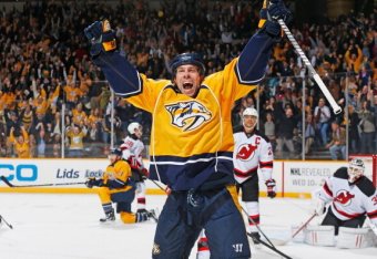 NASHVILLE, TN - JANUARY 31: David Legwand #11 of the Nashville Predators celebrates his game-tying goal in the final seconds against Cory Schneider #35 of the New Jersey Devils at Bridgestone Arena on January 31, 2014 in Nashville, Tennessee. (Photo by Jo
