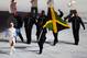 SOCHI, RUSSIA - FEBRUARY 07: Bobsleigh racer Marvin Dixon of the Jamaica Olympic team carries his country's flag during the Opening Ceremony of the Sochi 2014 Winter Olympics at Fisht Olympic Stadium on February 7, 2014 in Sochi, Russia. (Photo by Clive