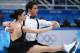 SOCHI, RUSSIA - FEBRUARY 08: Tessa Virtue and Scott Moir of Canada compete in the Figure Skating Team Ice Dance - Short Dance during day one of the Sochi 2014 Winter Olympics at Iceberg Skating Palace on February 8, 2014 in Sochi, Russia. (Photo by Robe