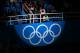SOCHI, RUSSIA - FEBRUARY 09: A spotlight shines on the Olympic rings during the flower ceremony for the Team Figure Skating Overall during day two of the Sochi 2014 Winter Olympics at Iceberg Skating Palace onon February 9, 2014 in Sochi, Russia. (Photo