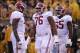 October 13, 2012; Columbia, MO, USA; Alabama Crimson Tide offensive linesman Cyrus Kouandjio (71) and offensive linesman D.J. Fluker (76) and offensive linesman Chance Warmack (65) talk during the first half at Faurot Field. Alabama won 42-10. Mandatory C