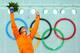 SOCHI, RUSSIA - FEBRUARY 09: Gold medalist Irene Wust of the Netherlands celebrates on the podium during the flower ceremony for the Women's 3000m Speed Skating event during day 2 of the Sochi 2014 Winter Olympics at Adler Arena Skating Center on Februar