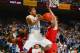 Feb 4, 2014; Chapel Hill, NC, USA; North Carolina Tar Heels guard Marcus Paige (5) scores as Maryland Terrapins forward Charles Mitchell (0) and forward Evan Smotrycz (1) defend in the second half. The North Carolina Tar Heels defeated the Maryland Terrap
