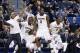 The Husky bench celebrates during Wednesday's game.