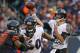 CHICAGO, IL - NOVEMBER 17: Joe Flacco #5 of the Baltimore Ravens passes as Eugene Monroe #60 blocks Julius Peppers #90 of the Chicago Bears at Soldier Field on November 17, 2013 in Chicago, Illinois. The Bears defeated the Ravens 23-20 in overtime. (Pho