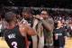 PORTLAND, OR - DECEMBER 28: LeBron James #6 and Dwayne Wade #3 put a jacket on Chris Bosh #1 of the Miami Heat after a game against the Portland Trailblazers on December 28, 2013 at the Moda Center Arena in Portland, Oregon. NOTE TO USER: User expressly