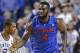 Feb 15, 2014; Lexington, KY, USA; Florida Gators center Patric Young (4) celebrates against Kentucky Wildcats guard Aaron Harrison (2) at Rupp Arena. Florida defeated Kentucky 69-59. Mandatory Credit: Mark Zerof-USA TODAY Sports