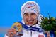 Kamil Stoch of Poland with one of his two gold medals from Sochi