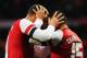 LONDON, ENGLAND - FEBRUARY 16: (L-R) Lukas Podolski of Arsenal celebrates scoring with team mate Alex Oxlade-Chamberlain during the FA Cup Fifth Round match between Arsenal and Liverpool at the Emirates Stadium on February 16, 2014 in London, England. (