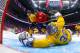 Henrik Lundqvist #30 of Sweden makes a save against Nino Niederreiter #22 of Switzerland in the first period during the Men's Ice Hockey Preliminary Round Group C game on day seven of the Sochi 2014 Winter Olympics at Bolshoy Ice Dome on February 14, 2014