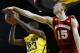 Feb 16, 2014; Ann Arbor, MI, USA; Wisconsin Badgers forward Sam Dekker (15) fouls Michigan Wolverines guard Caris LeVert (23) at Crisler Arena. Mandatory Credit: Rick Osentoski-USA TODAY Sports