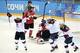 Feb 12, 2014; Sochi, RUSSIA; USA forward Hilary Knight (21) celebrates with teammates forward Alex Carpenter (25) and forward Kelli Stack (16) after a goal against Canada in a women's ice hockey preliminary round game during the Sochi 2014 Olympic Winter