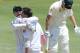 PRETORIA, SOUTH AFRICA - FEBRUARY 12: AB de Villiers and Dale Steyn of South Africa celebrate the wicket of Michael Clarke of Austrailia during day one of the First Test match between South Africa and Australia at SuperSport Park on February 12, 2014 in C