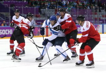 SOCHI, RUSSIA - FEBRUARY 13: Tuomo Ruutu #15 of Finland skates against Austria during the Men's Ice Hockey Preliminary Round Group B game on day six of the Sochi 2014 Winter Olympics at Bolshoy Ice Dome on February 13, 2014 in Sochi, Russia. (Photo by B