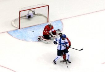 SOCHI, RUSSIA - FEBRUARY 16: Tuomo Ruutu #15 of Finland scores a goal in the second period against Carey Price #31 of Canada during the Men's Ice Hockey Preliminary Round Group B game on day nine of the Sochi 2014 Winter Olympics at Bolshoy Ice Dome on F
