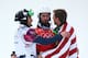 SOCHI, RUSSIA - FEBRUARY 18: (L-R) Silver medalist Nikolay Olyunin of Russia, gold medalist Pierre Vaultier of France and bronze medalist Alex Deibold of the United States on the podium during the flower ceremony for the Men's Snowboard Cross Final on da