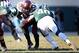 Nov 30, 2013; East Lansing, MI, USA; Minnesota Golden Gophers running back Donnell Kirkwood (20) is tackled by Michigan State Spartans linebacker Max Bullough (40) during the 2nd half a game at Spartan Stadium. MSU won 14-3. Mandatory Credit: Mike Carter