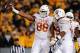 Nov 9, 2013; Morgantown, WV, USA; Texas Longhorns defensive end Cedric Reed (88) reacts after recovering a fumble in the second quarter against the West Virginia Mountaineers at Milan Puskar Stadium. Mandatory Credit: Evan Habeeb-USA TODAY Sports