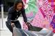 Feb 16, 2014; Krasnaya Polyana, RUSSIA; United States team member Lauryn Williams working on the team sled during women's bobsleigh training of the Sochi 2014 Olympic Winter Games at Sanki Sliding Center. Mandatory Credit: Kevin Jairaj-USA TODAY Sports