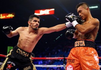 LAS VEGAS, NV - DECEMBER 08:  (L-R) Miguel Angel Vazquez throws a left to the face of Mercito Gesta during their IBF world lightweight title fight at the MGM Grand Garden Arena on December 8, 2012 in Las Vegas, Nevada.  (Photo by Al Bello/Getty Images)