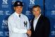 NEW YORK, NY - FEBRUARY 11: Masahiro Tanaka of the New York Yankees shakes hands with manager Joe Girardi as he introduced to the media during a news conference on February 11, 2014 at Yankee Stadium in the Bronx borough of New York City. (Photo by Jim