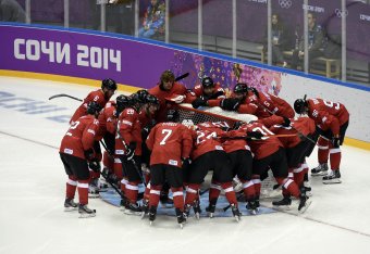 Feb 14, 2014; Sochi, RUSSIA; Switzerland players huddle up before a men's preliminary round ice hockey game against Sweden during the Sochi 2014 Olympic Winter Games at Bolshoy Ice Dome. Mandatory Credit: Scott Rovak-USA TODAY Sports