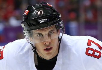 SOCHI, RUSSIA - FEBRUARY 19:  Sidney Crosby #87 of Canada faces off against Latvia during the Men's Ice Hockey Quarterfinal Playoff on Day 12 of the 2014 Sochi Winter Olympics at Bolshoy Ice Dome on February 19, 2014 in Sochi, Russia.  (Photo by Bruce Ben