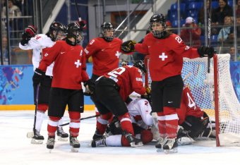 SOCHI, RUSSIA - FEBRUARY 17:  Laura Benz #21 of Switzerland and teammates react after a disallowed goal against Canada during the Women's Ice Hockey Playoffs Semifinal game on day ten of the Sochi 2014 Winter Olympics at Shayba Arena on February 17, 2014 