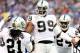 EAST RUTHERFORD, NJ - NOVEMBER 10: Lamarr Houston #99 of the Oakland Raiders celebrates after he recovers a fumble by Peyton Hillis of the New York Giants at MetLife Stadium on November 10, 2013 in East Rutherford, New Jersey. (Photo by Elsa/Getty Imag