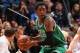 MINNEAPOLIS, MN - NOVEMBER 16: MarShon Brooks #12 of the Boston Celtics passes the ball against the Minnesota Timberwolves November 16, 2013 at Target Center in Minneapolis, Minnesota. NOTE TO USER: User expressly acknowledges and agrees that, by downlo