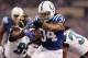 INDIANAPOLIS, IN - DECEMBER 29: Trent Richardson #34 of the Indianapolis Colts runs for a fist quarter touchdown past the tackle of Sen'Derrick Marks #99 and Johnathan Cyprien #37 of the Jacksonville Jaguars of the Jacksonville Jaguars at Lucas Oil Stadiu
