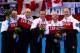 SOCHI, RUSSIA - FEBRUARY 21: (L-R) Gold medalists Caleb Flaxey, Ryan Harnden, EJ Harnden, Ryan Fry and Brad Jacobs of Canada celebrate during the flower ceremony for the Men's Gold Medal match between Canada and Great Britain on day 14 of the Sochi 2014